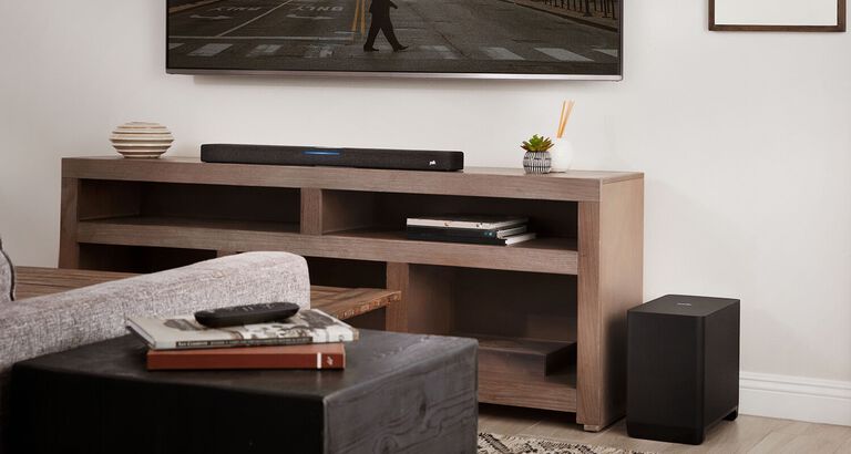 A furnished room with a mounted TV and soundbar. A furnished room with a mounted TV and soundbar.