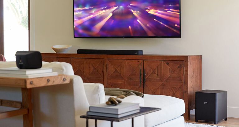 A furnished room with a mounted TV and soundbar. A furnished room with a mounted TV and soundbar.