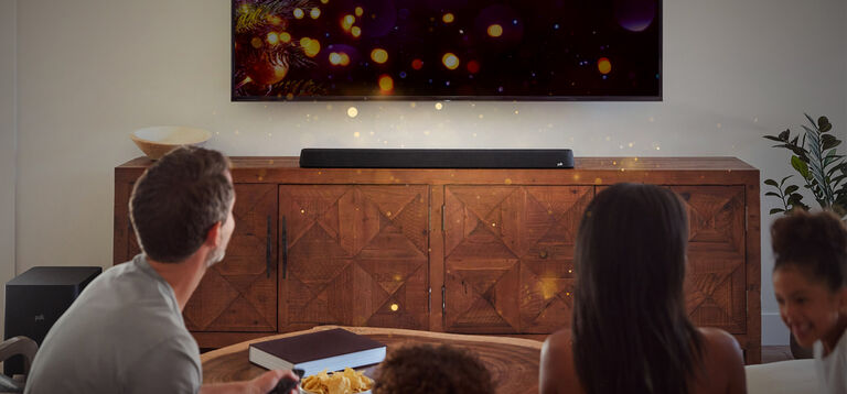 A family watching TV. A family watching TV.